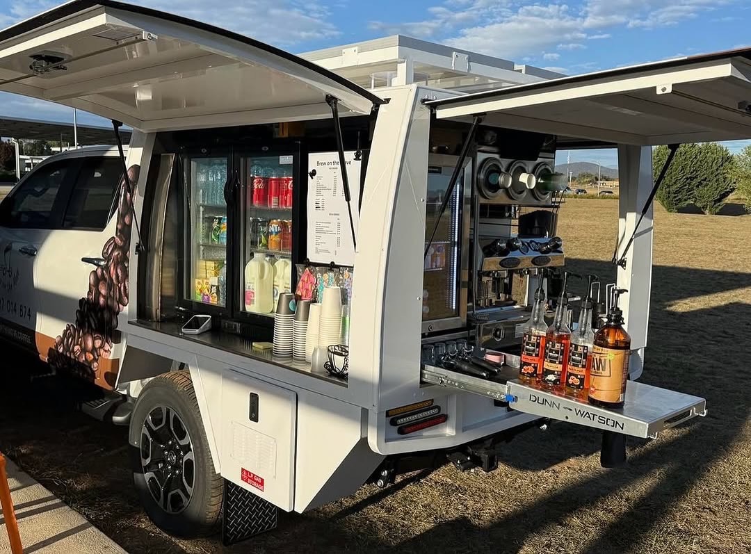 White ute canopy fit-out, gullwing doors open, espresso machine and fridge