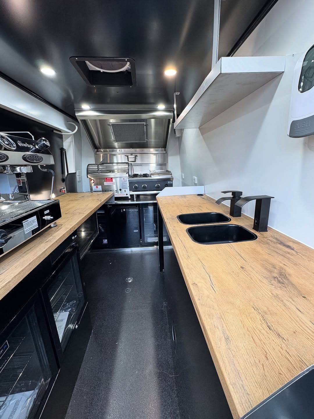 Food truck interior with sinks and cabinetry