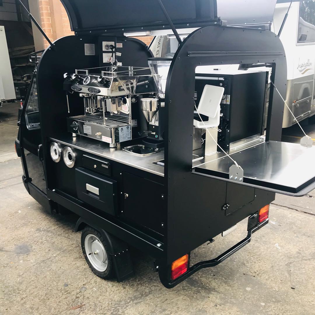 Black Piaggio Ape, rear three-quarter view