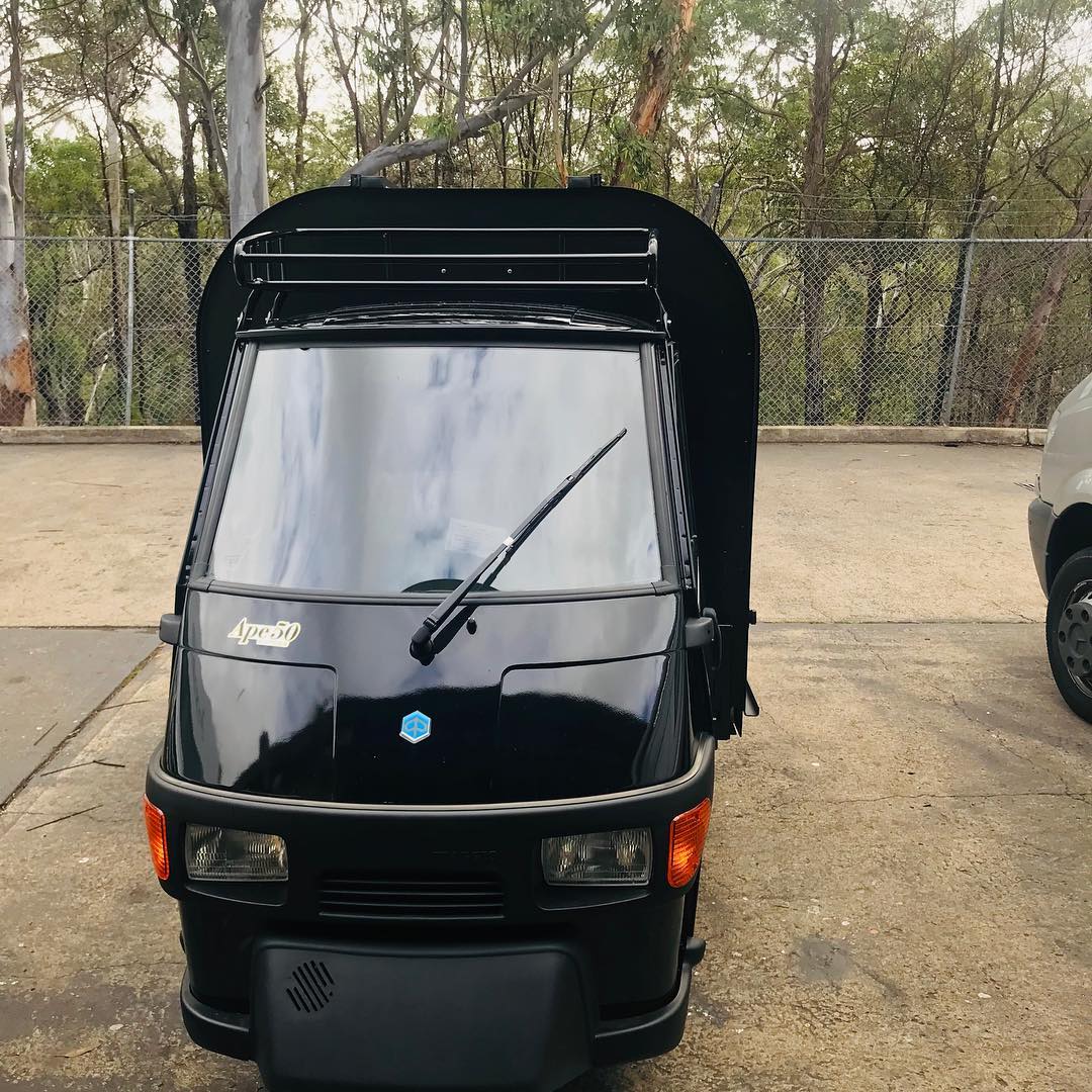 Black Piaggio Ape front cab