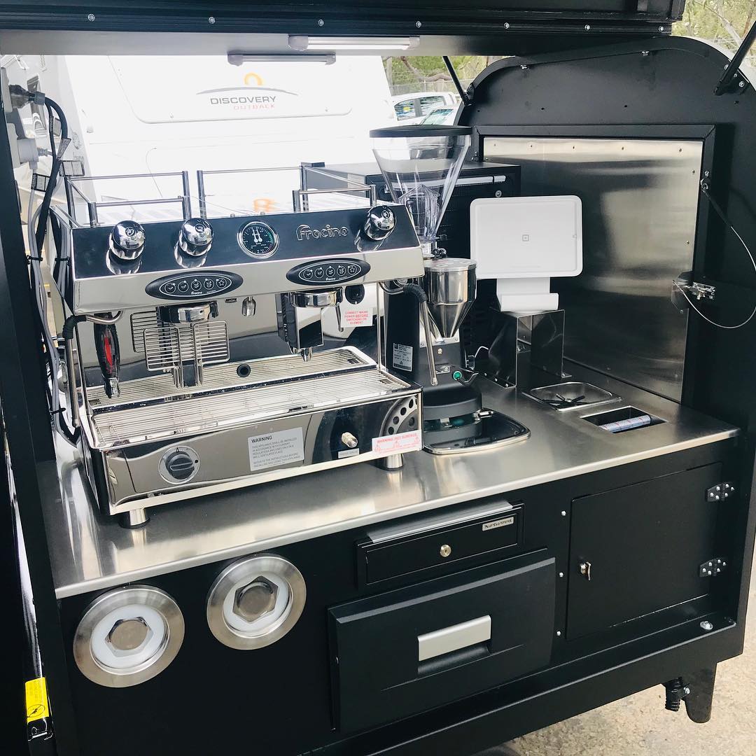 Espresso machine and grinder detail on a black Ape tray