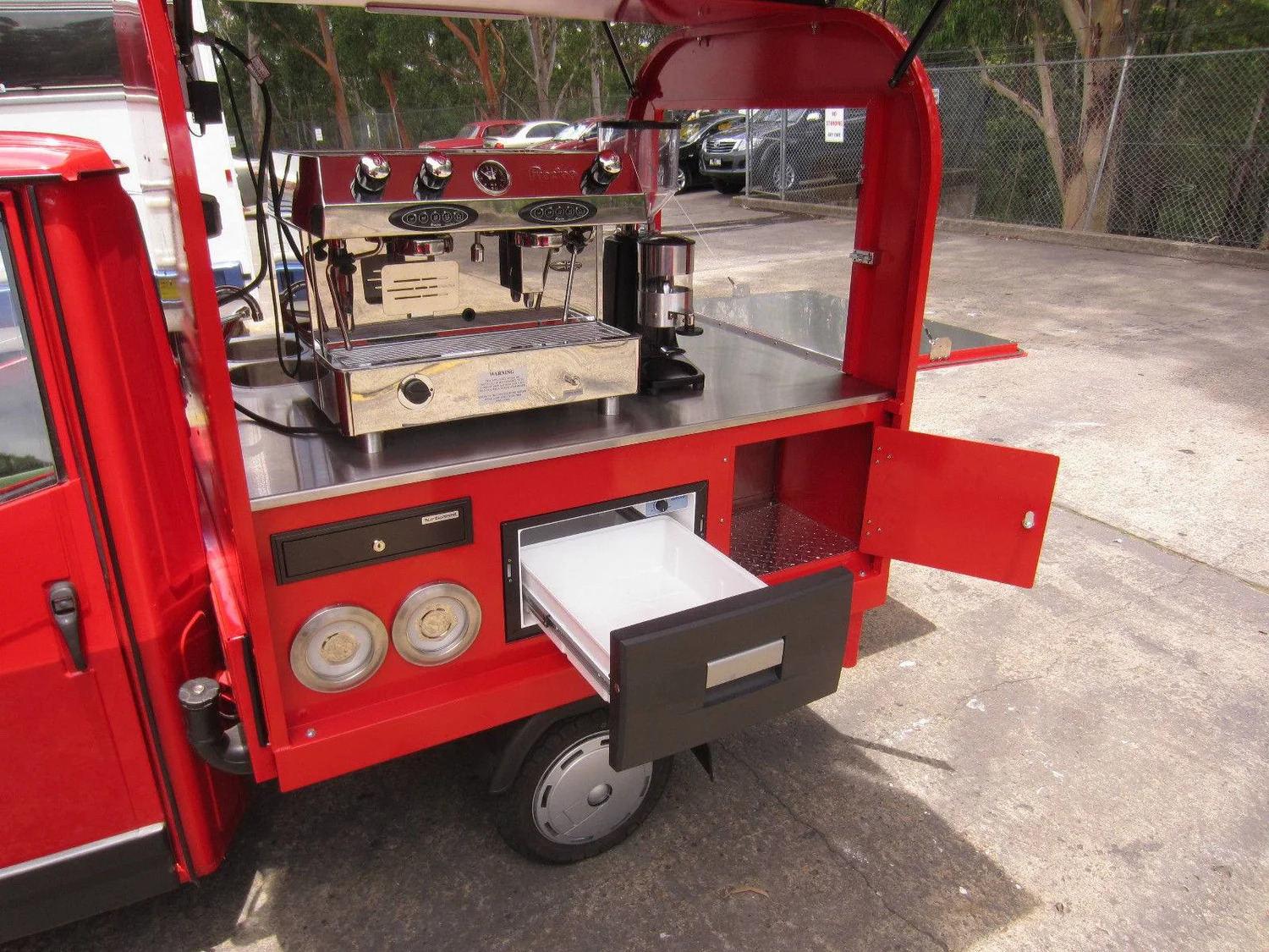 Classic red Piaggio Ape espresso van, rear tray open