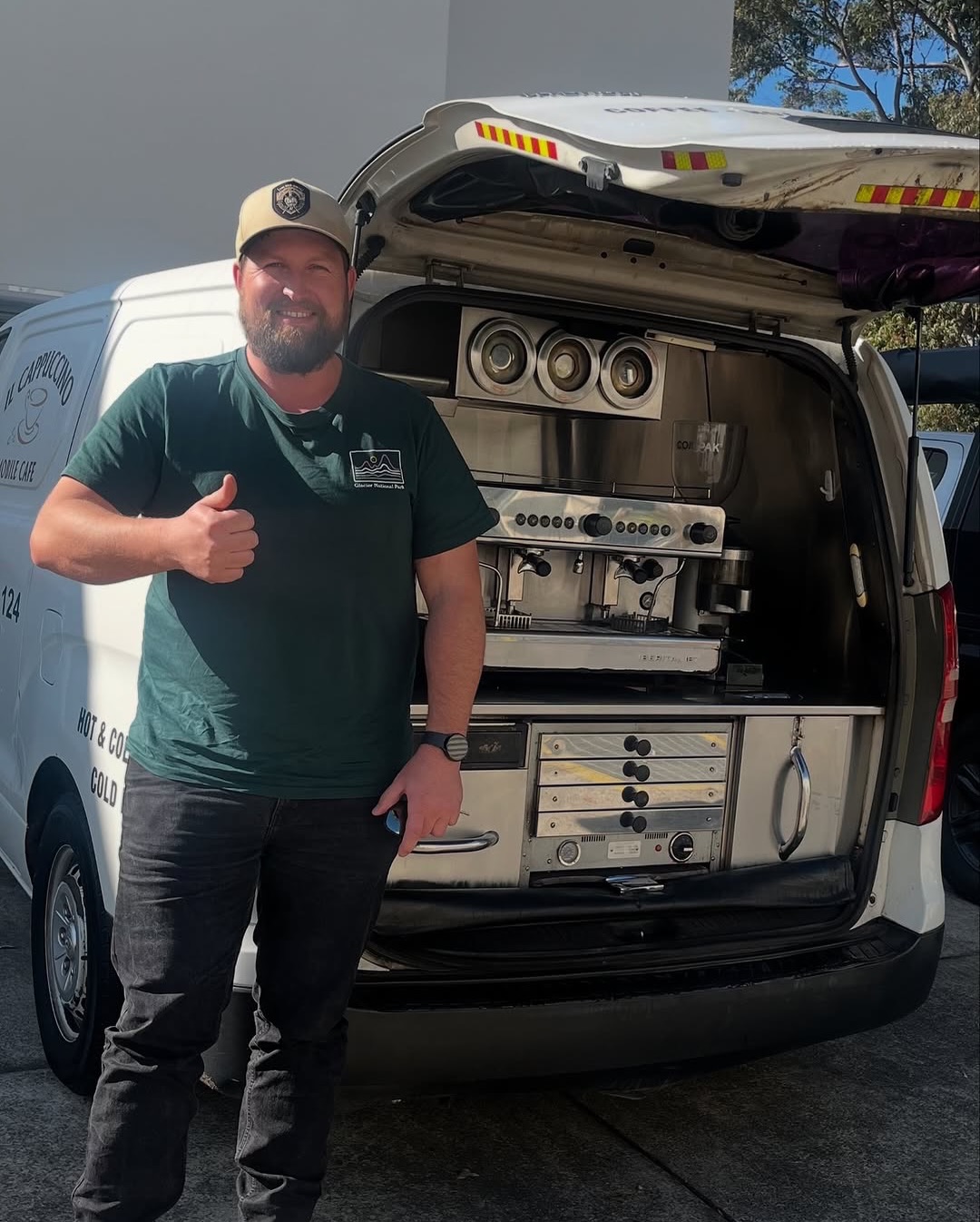 Rear hatch coffee set-up, operator giving thumbs up