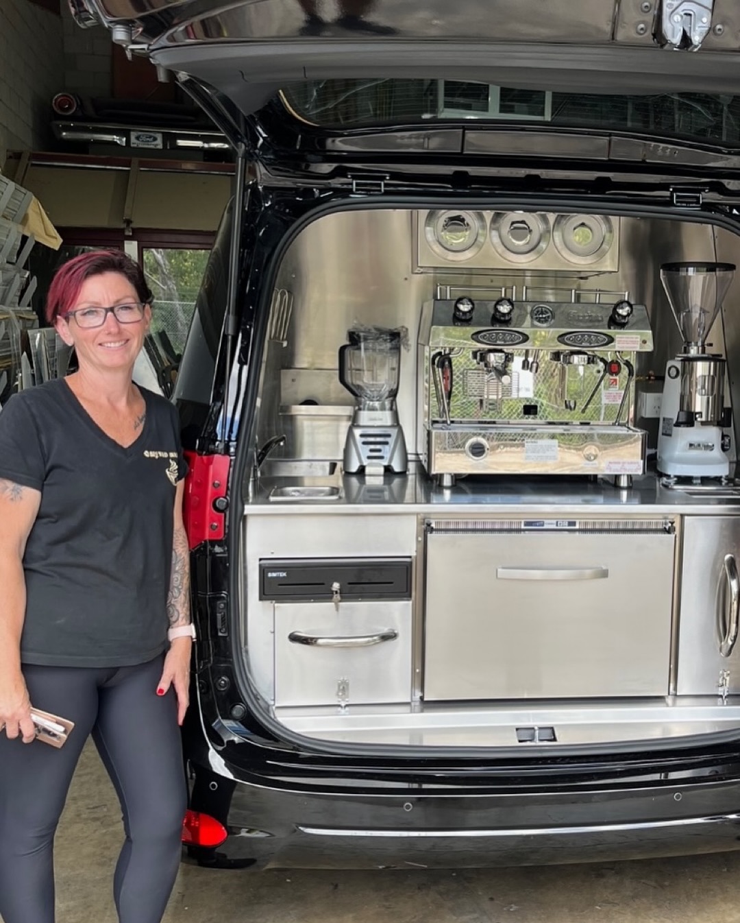Black minivan rear hatch, espresso machine and grinder