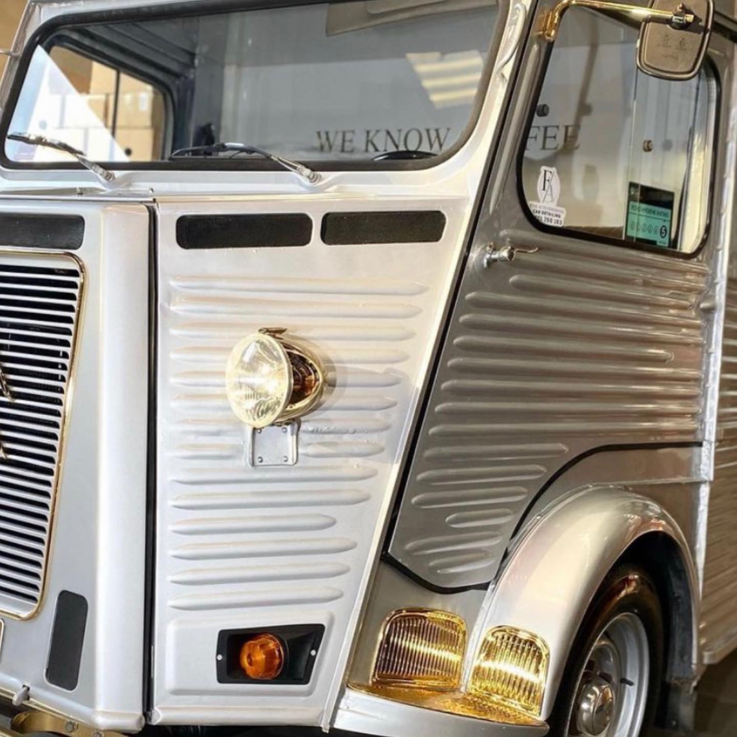 Restored Citroen HY van front detail with gold trim and headlight