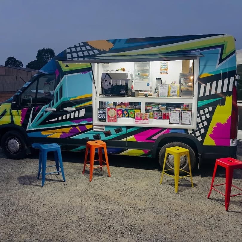 Curby's Coffee, fully wrapped exterior with stools
