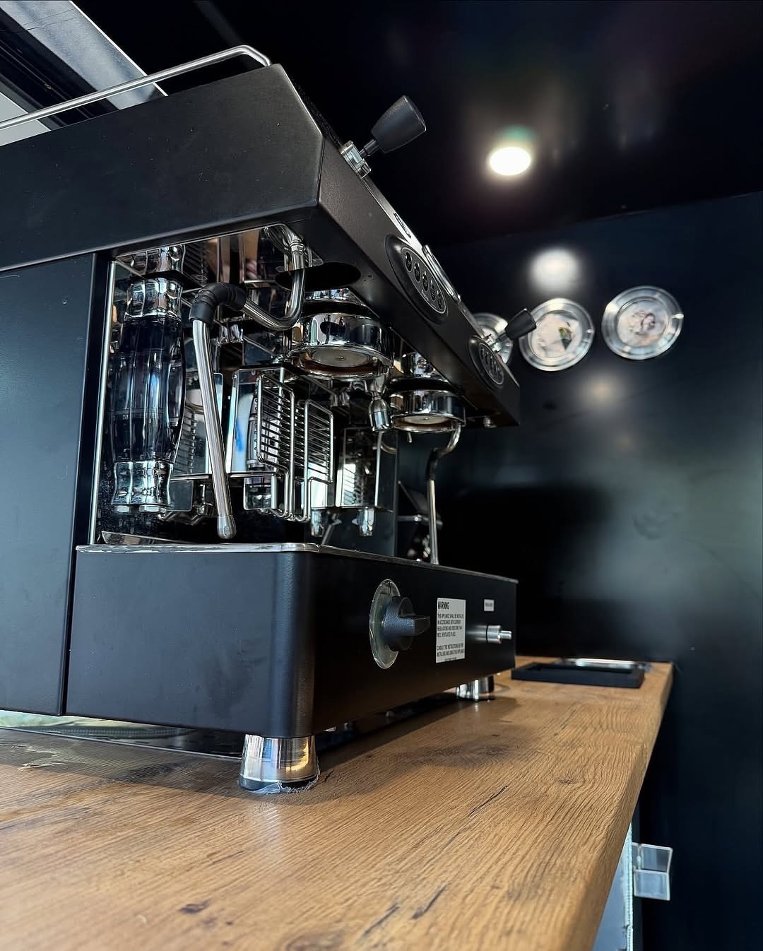 Espresso machine detail on timber bench